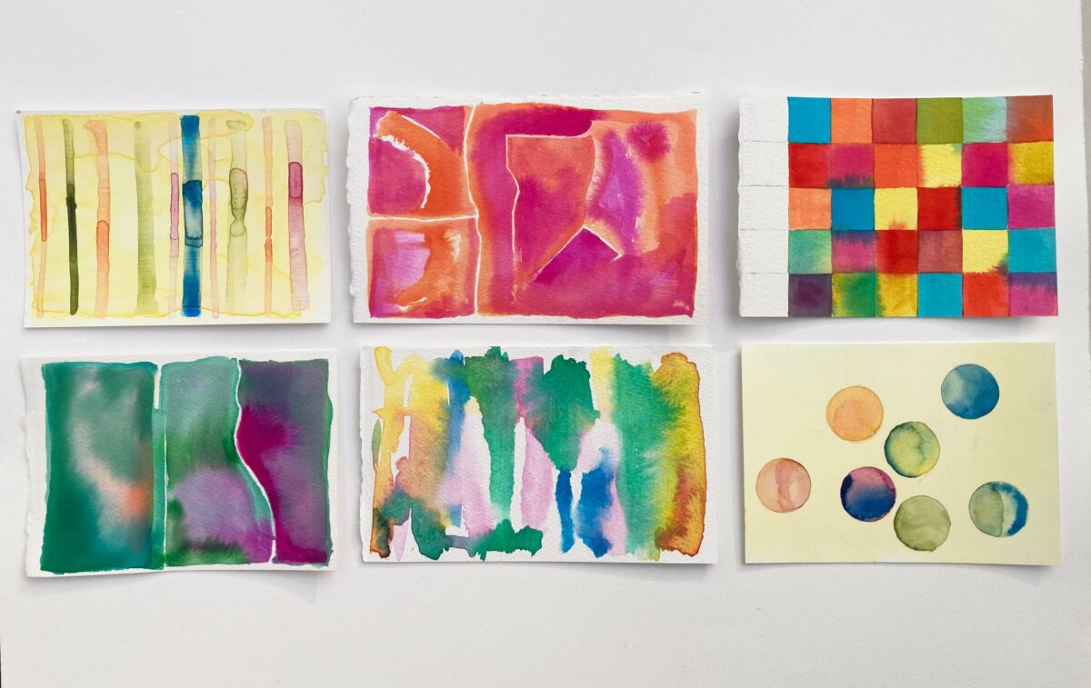 Six postcards, image side up, in two rows of three. They feature vertical stripes, a grid of color blocks, floating dots, and generally a lot of watery colors bleeding into each other. The colors are bright and translucent.