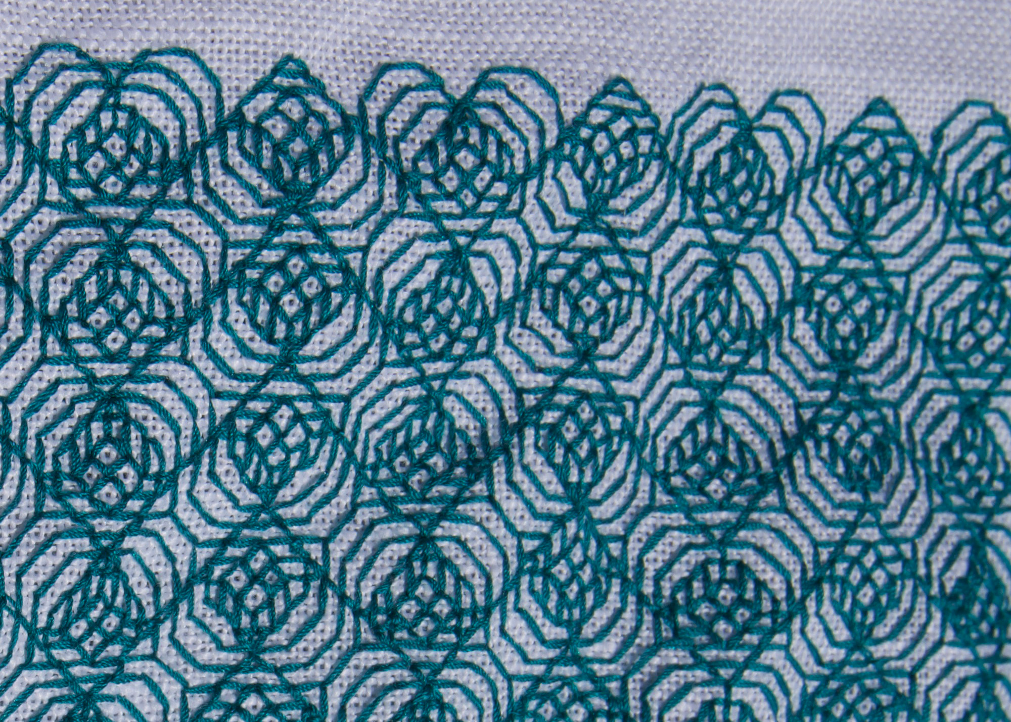 heart-motif diaper pattern in green silk on white linen