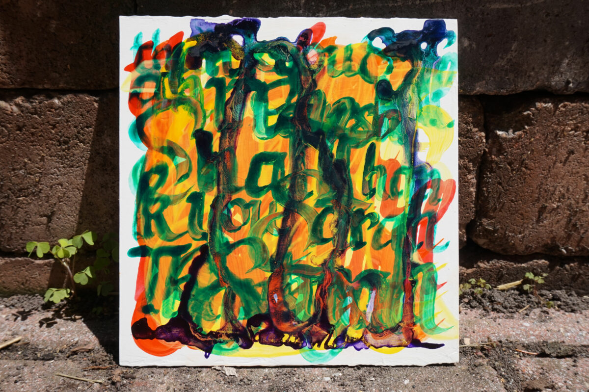An abstract painting on a square sheet of gatorboard with bricks in the background; text is illegible but reads Thank you Sarah Marshall.