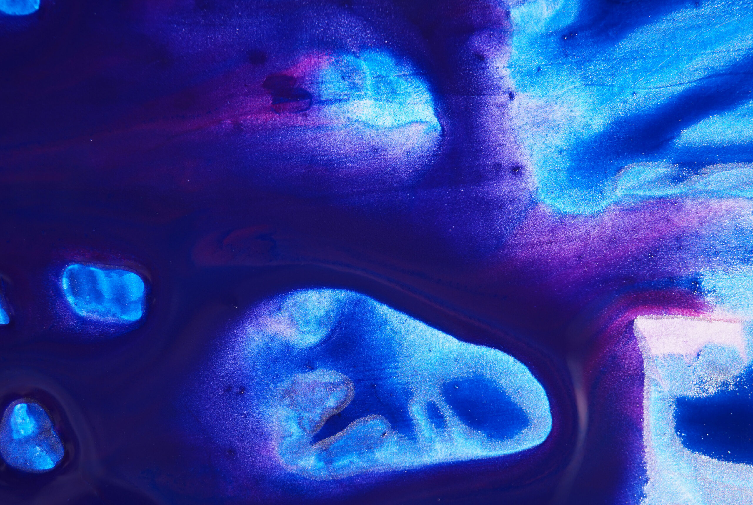 blue and purple layered, watery calligraphy drawn with acrylic paint and ink on gator board, extreme close-up