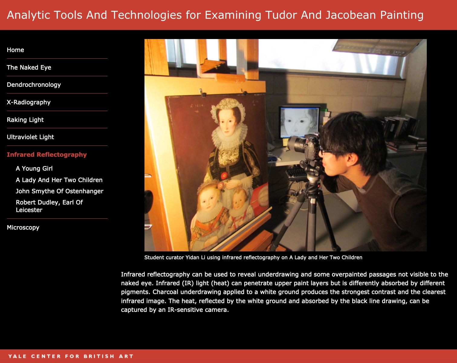 Student curator Yidan Li using infrared reflectography on ‘A Lady and Her Two Children’